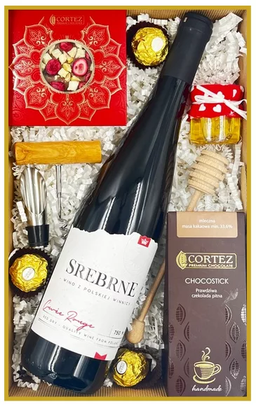 Zestaw prezentowy z polskim winem czerwonym Srebrne, czekoladą pitną Chocostick, pralinami Ferrero Rocher i miodem.